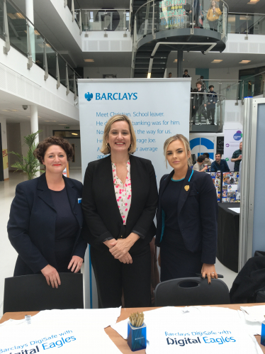 Amber is pictured with staff members from Barclays Bank